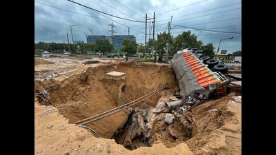 Due to heavy rainfall last Wednesday, a portion of the slip road at the intersection of SPR and Sector 75 and 75A road had caved in, and a truck carrying liquor had got stuck in a very large cavity. Heavy congestion and traffic jams were witnessed for the next three to four days on this section of the road. (HT PHOTO) Due to heavy rainfall last Wednesday, a portion of the slip road at the intersection of SPR and Sector 75 and 75A road had caved in, and a truck carrying liquor had got stuck in a very large cavity. Heavy congestion and traffic jams were witnessed for the next three to four days on this section of the road. (HT PHOTO)
