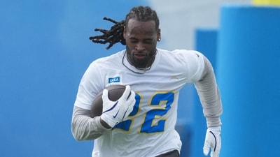 May 12, 2025; El Segundo, CA, USA; Los Angeles Chargers running back Najee Harris (22) carries the ball during offseason workouts at The Bolt. Mandatory Credit: Kirby Lee-Imagn Images (IMAGN IMAGES via Reuters Connect)