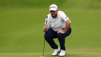 Ireland's Shane Lowry lines up a putt on the first green during the third round. (REUTERS) Ireland's Shane Lowry lines up a putt on the first green during the third round. (REUTERS)