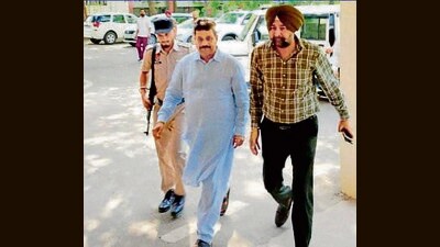 Raman Arora (centre) was arrested on May 23 following a month-long investigation in an alleged corruption and extortion racket being run under his patronage. (HT Photo) Raman Arora (centre) was arrested on May 23 following a month-long investigation in an alleged corruption and extortion racket being run under his patronage. (HT Photo)