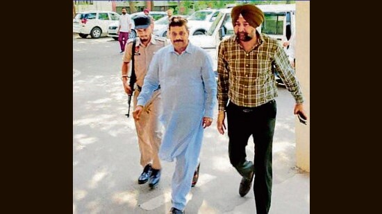 Raman Arora (centre) was arrested on May 23 following a month-long investigation in an alleged corruption and extortion racket being run under his patronage. (HT Photo)