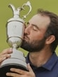 Scottie Scheffler kisses the Claret Jug after winning the British Open golf championship on Sunday. (AP)