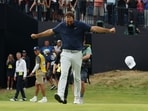 Scottie Scheffler of the U.S. celebrates on the 18th green after winning The 153rd Open Championship 