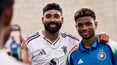 Mohammed Siraj poses for a photo with Amad Diallo. (X) Mohammed Siraj poses for a photo with Amad Diallo. (X)