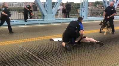 Following an anti-ICE protest in Covington, Kentucky, an officer was placed on administrative leave after body camera footage showed him using excessive force against a protester. (@gpirnia/ X) Following an anti-ICE protest in Covington, Kentucky, an officer was placed on administrative leave after body camera footage showed him using excessive force against a protester. (@gpirnia/ X)