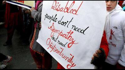 Disabled persons participate in a peaceful march on World Disability Day in Srinagar. PTI Disabled persons participate in a peaceful march on World Disability Day in Srinagar. PTI