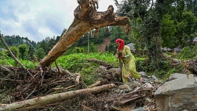 A woman searches for her belongings at a disaster-affected area, in Mandi district, Himachal Pradesh, Saturday, July 19, 2025. (PTI) A woman searches for her belongings at a disaster-affected area, in Mandi district, Himachal Pradesh, Saturday, July 19, 2025. (PTI)