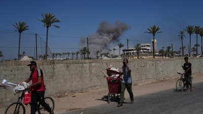 Palestinians flee Deir al-Balah in central Gaza Sunday, July 20, 2025, after the Israeli military issued evacuation orders ahead of expected operations in the area. Since the war began in October 2023, Israel has made it harder to get visas for those working for OCHA, the UN human rights office OHCHR and the UN agency for Palestinian refugees UNRWA. (AP)