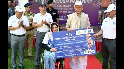 J&K LG Manoj Sinha presents a cheque to a runner-up participant during the J&K Police’s Pedal Through Paradise Cycle Race, in Srinagar, on Sunday. (ANI) J&K LG Manoj Sinha presents a cheque to a runner-up participant during the J&K Police’s Pedal Through Paradise Cycle Race, in Srinagar, on Sunday. (ANI)