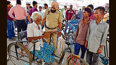 Officials during a raid to rescue child beggars at the railway station in Ludhiana on Sunday. (Gurpreet Singh/HT) Officials during a raid to rescue child beggars at the railway station in Ludhiana on Sunday. (Gurpreet Singh/HT)