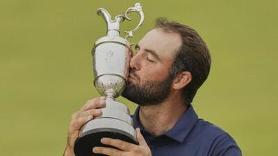 Scottie Scheffler kisses the Claret Jug after winning the British Open golf championship on Sunday. (AP) Scottie Scheffler kisses the Claret Jug after winning the British Open golf championship on Sunday. (AP)