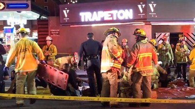 Members of emergency services work at the scene after a vehicle plunged into a crowd outside a nightclub, on Santa Monica Boulevard in the East Hollywood of Los Angeles, California, U.S., July 19, 2025, in this screen grab obtained from social media. (AXN NEWS/via REUTERS) (AXN NEWS via REUTERS)
