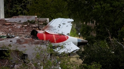 The tail of the Air India Boeing 787 Dreamliner was stuck on the hostel building after a crash in Ahmedabad. (Reuters)