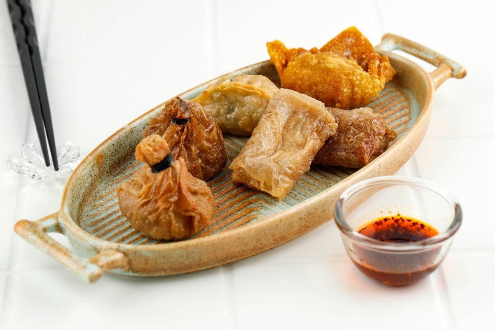 Dim sums are dipped in chilli oils. (Shutterstock) Dim sums are dipped in chilli oils. (Shutterstock)