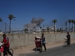 Palestinians flee Deir al-Balah in central Gaza Sunday, July 20, 2025, after the Israeli military issued evacuation orders ahead of expected operations in the area.