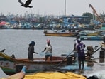 Fisherman mend their net at Kasimedu fishing harbour in Chennai as several parts of Tamil Nadu are likely to witness heavy rainfall for the next few days.