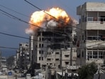 Smoke and flames rise from a residential building hit by an Israeli strike, in Gaza City July 21, 2025.