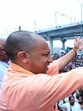 Uttar Pradesh Chief Minister Yogi Adityanath showering flowers on Kanwariyas in Meerut on Sunday. (Sakib Ali / HT PHOTO) Uttar Pradesh Chief Minister Yogi Adityanath showering flowers on Kanwariyas in Meerut on Sunday. (Sakib Ali / HT PHOTO)