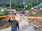 A resident leaves his house in the aftermath of torrential rain, in Gapyeong, South Korea July 21