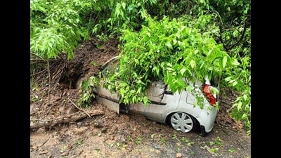 A parked vehicle buried under the debris after landslide near Chaura Medan, Shimla on Monday. (Deepak Sansta/HT)