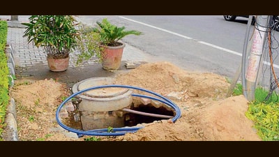 A pit dug in the road by private companies to lay wires defying MC’s permission in BRS Nagar I-Block in Ludhiana on Monday. (Manish/HT) A pit dug in the road by private companies to lay wires defying MC’s permission in BRS Nagar I-Block in Ludhiana on Monday. (Manish/HT)