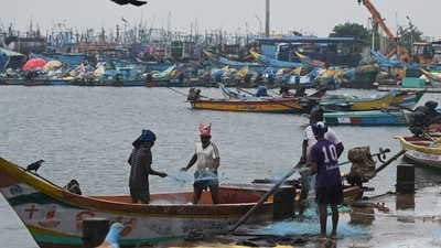 Fisherman mend their net at Kasimedu fishing harbour in Chennai as several parts of Tamil Nadu are likely to witness heavy rainfall for the next few days. (AFP) Fisherman mend their net at Kasimedu fishing harbour in Chennai as several parts of Tamil Nadu are likely to witness heavy rainfall for the next few days. (AFP)