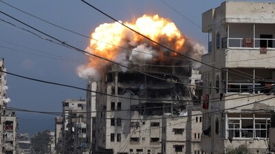 Smoke and flames rise from a residential building hit by an Israeli strike, in Gaza City July 21, 2025. (REUTERS)