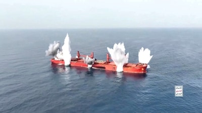 Plumes of smoke rise from what is said to be Liberia-flagged, Greek-operated bulk carrier, the MV Magic Seas that was, according to Yemen's Houthis, attacked following an alleged exchange with the captain, off southwest Yemen. (HOUTHI MEDIA CENTER/Handout via REUTERS)