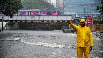 A traffic policeman at the flooded Andheri Subway during heavy rain, in Mumbai, Maharashtra, Monday, July 21, 2025. (PTI) A traffic policeman at the flooded Andheri Subway during heavy rain, in Mumbai, Maharashtra, Monday, July 21, 2025. (PTI)