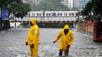 Traffic police personnel at the flooded Andheri Subway during heavy rain, in Mumbai, Maharashtra, Monday, July 21, 2025. (PTI) Traffic police personnel at the flooded Andheri Subway during heavy rain, in Mumbai, Maharashtra, Monday, July 21, 2025. (PTI)