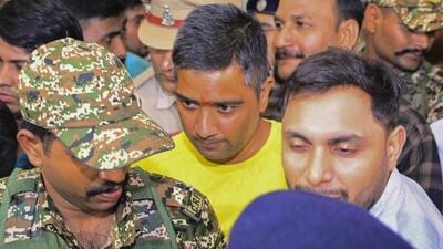 Raipur: Security personnel and others escort Chaitanya Baghel, in yellow, son of former chief minister Bhupesh Baghel, after his arrest by the Enforcement Directorate (ED) in Raipur. (PTI FILE PHOTO) Raipur: Security personnel and others escort Chaitanya Baghel, in yellow, son of former chief minister Bhupesh Baghel, after his arrest by the Enforcement Directorate (ED) in Raipur. (PTI FILE PHOTO)