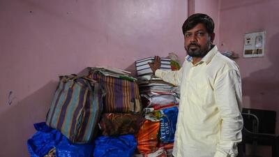 Sajid Ansari, one of the men acquitted, is currently out on parole. He is seen here in his Mira Road home, against the mountain of documents that helped him fight his case. (photo by Raju Shinde) (Raju Shinde) Sajid Ansari, one of the men acquitted, is currently out on parole. He is seen here in his Mira Road home, against the mountain of documents that helped him fight his case. (photo by Raju Shinde) (Raju Shinde)