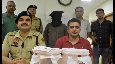 The accused and the seized firearms in the custody of Panchkula police. (Sant Arora)