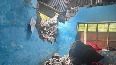 The damaged wall of the Government School in Bhainch panchayat in Poonch district after a boulder came rolling down a hillside amid heavy rain in the area on Monday morning. (HT Photo) The damaged wall of the Government School in Bhainch panchayat in Poonch district after a boulder came rolling down a hillside amid heavy rain in the area on Monday morning. (HT Photo)
