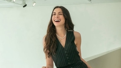 Anne Hathaway is all smiles as she steps in the character of Andy Sachs. Anne Hathaway is all smiles as she steps in the character of Andy Sachs.