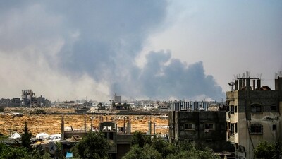 Smoke billows from Israeli bombardment as pictured from Deir el-Balah in the central Gaza Strip on July 21. (AFP)