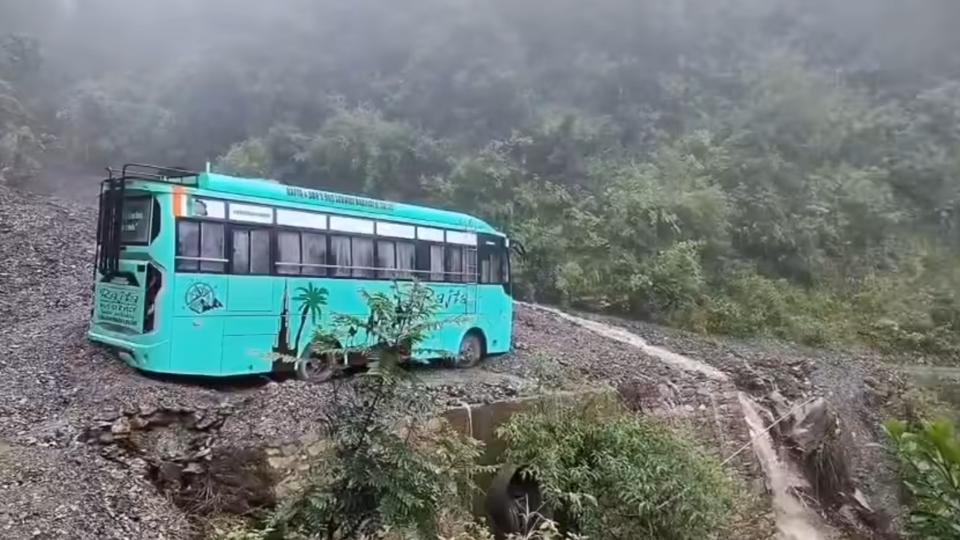 A private bus caught in debris after a flashflood on the Sangraha-Chadna road in Sirmaur district on Monday. Passengers escaped unhurt. (HT Photo) A private bus caught in debris after a flashflood on the Sangraha-Chadna road in Sirmaur district on Monday. Passengers escaped unhurt. (HT Photo)