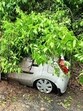 A parked vehicle buried under the debris after landslide near Chaura Medan, Shimla on Monday. (Deepak Sansta/HT) A parked vehicle buried under the debris after landslide near Chaura Medan, Shimla on Monday. (Deepak Sansta/HT)