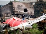 A firefighter stands next to the crashed Air India Boeing 787-8 Dreamliner aircraft, in Ahmedabad.