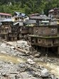 Debris and silt near damaged houses at a flood-affected area in Mandi district of Himachal Pradesh on July 6. (PTI) Debris and silt near damaged houses at a flood-affected area in Mandi district of Himachal Pradesh on July 6. (PTI)