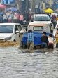 Group of people push a stranded vehicle after heavy rainfall caused waterlogging in several parts of the city on Wednesday morning. (Manish/HT) Group of people push a stranded vehicle after heavy rainfall caused waterlogging in several parts of the city on Wednesday morning. (Manish/HT)