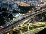 An aerial view shows the Namma Metro train of Bengaluru Metro Rail Corporation Limited (BMRCL), riding over a flyover in Bengaluru.