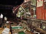 In this July 11, 2006 file photo, policemen investigate near a train coach destroyed by a bomb blast at Matunga railway station in Mumbai. In this July 11, 2006 file photo, policemen investigate near a train coach destroyed by a bomb blast at Matunga railway station in Mumbai.
