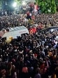 People gather outside the AKG Centre to pay their respects as the mortal remains of former Kerala chief minister and veteran CPI(M) leader V S Achuthanandan being brought in an ambulance, in Thiruvananthapuram, on Monday. (PTI) People gather outside the AKG Centre to pay their respects as the mortal remains of former Kerala chief minister and veteran CPI(M) leader V S Achuthanandan being brought in an ambulance, in Thiruvananthapuram, on Monday. (PTI)