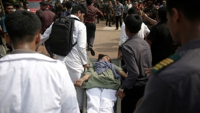 Volunteers rescue an injured girl from the crash site. Several people were injured in the crash and were rushed to the hospital for treatment. (REUTERS)