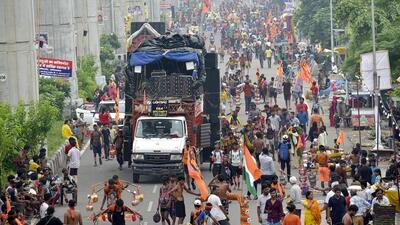 People, accompanied by loud DJ music, carry holy water on the Ghaziabad-Delhi Meerut road as part of the Kanwar Yatra on Monday. (Sakib Ali/ HT Photo) People, accompanied by loud DJ music, carry holy water on the Ghaziabad-Delhi Meerut road as part of the Kanwar Yatra on Monday. (Sakib Ali/ HT Photo)