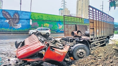 Thane, India - July -22, 2025:Two killed in accident on Thane Ghodbunder Road, A truck carrying iron pipes from Navi Mumbai to Gujarat crashed into a divider on Ghodbunder Road Patlipada Bridge after the driver lost control of the vehicle. In this accident, both the driver and the cleaner were stuck on the track But both of them died in this accident .,in Thane,in Mumbai, India, on, Tuesday, July -22, 2025. ( Praful Gangurde / HT Photo ) (praful Gangurde) Thane, India - July -22, 2025:Two killed in accident on Thane Ghodbunder Road, A truck carrying iron pipes from Navi Mumbai to Gujarat crashed into a divider on Ghodbunder Road Patlipada Bridge after the driver lost control of the vehicle. In this accident, both the driver and the cleaner were stuck on the track But both of them died in this accident .,in Thane,in Mumbai, India, on, Tuesday, July -22, 2025. ( Praful Gangurde / HT Photo ) (praful Gangurde)