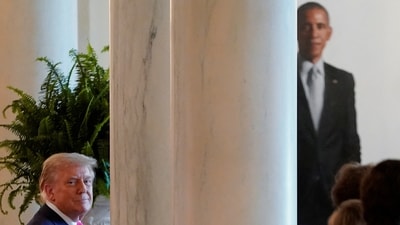 Donald Trump looks on as the portrait of Barack Obama can be seen in the background. (REUTERS)