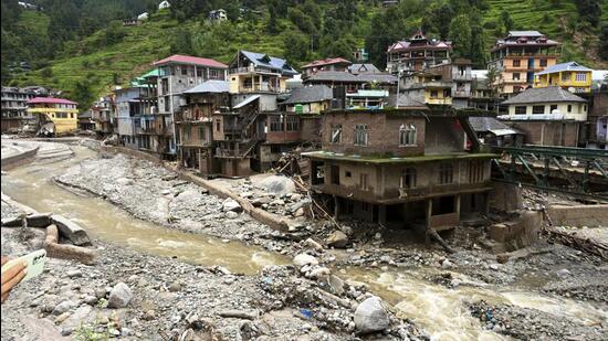 Debris and silt near damaged houses at a flood-affected area in Mandi district of Himachal Pradesh on July 6. (PTI)