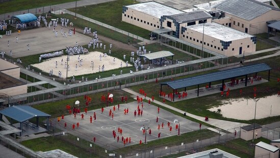 At a Miami immigration detention center, migrants were held in cells for hours without lunch and remained shackled while eating around 7 p.m. (Getty Images via AFP)